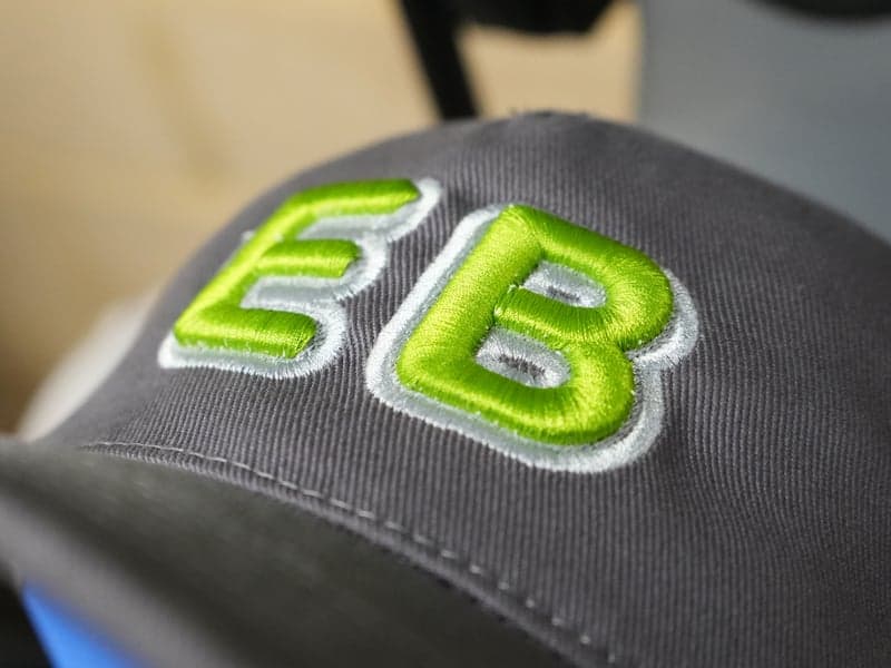 Production Result: 3D Puff Cap | Bold block letters with clean satin column coverage on heavy buckram.
